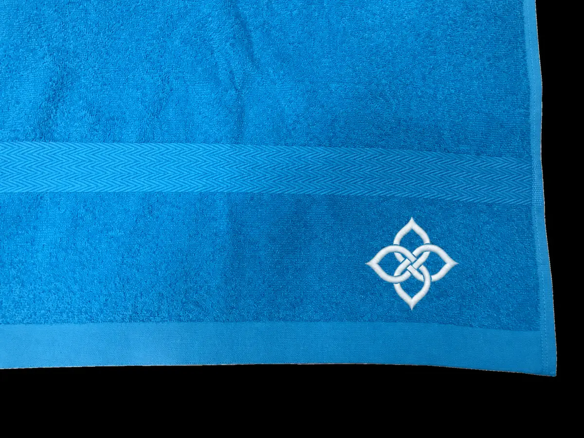 Blue towel with complete abstract embroidery